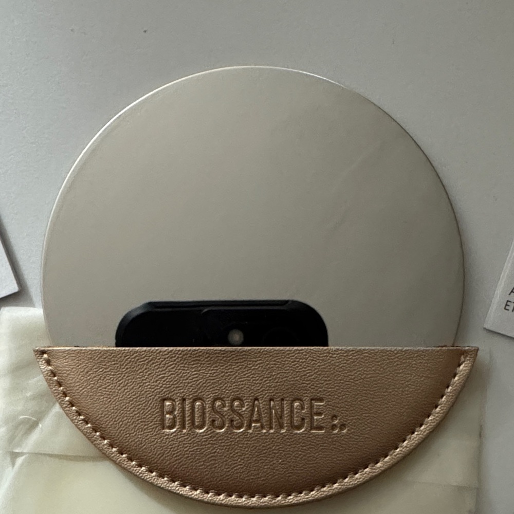 Biossance Silver Compact with Tan Case
